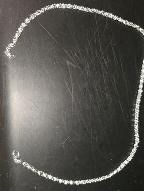 Eye-catching silver-tone chain with a bold, twisted textured link — every facet